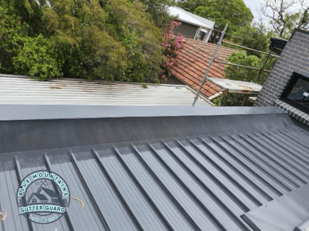 A durable gutter guard installed on a box gutter, ensuring long-lasting performance and protection.